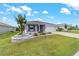 Charming single-story home featuring a well-manicured lawn and a two-car garage at 8913 Sw 76Th Ln, Ocala, FL 34481