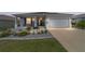 Inviting single-story home with a charming front porch and well-kept landscaping at 8913 Sw 76Th Ln, Ocala, FL 34481