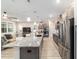 Contemporary kitchen featuring a large island, stainless steel appliances, and an open-concept design at 8913 Sw 76Th Ln, Ocala, FL 34481