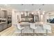 Modern kitchen with a large island, stainless steel appliances, and a sleek design at 8913 Sw 76Th Ln, Ocala, FL 34481