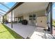 Expansive screened-in patio offering plenty of space for outdoor activities and relaxation with a view of the lawn at 8913 Sw 76Th Ln, Ocala, FL 34481
