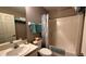Well-lit bathroom featuring a shower-tub combo and ample counter space at 9047 Sw 102Nd Cir, Ocala, FL 34481