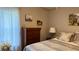 Serene bedroom with soft lighting, dresser, and comfortable bed at 9047 Sw 102Nd Cir, Ocala, FL 34481