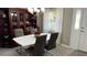 Elegant dining room with modern table, chairs, and natural light at 9047 Sw 102Nd Cir, Ocala, FL 34481