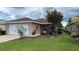 Charming single-story home featuring a well-manicured lawn and delightful landscaping at 9047 Sw 102Nd Cir, Ocala, FL 34481