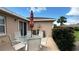 The screened-in patio includes a glass table, 6 chairs, and an umbrella at 9047 Sw 102Nd Cir, Ocala, FL 34481
