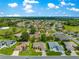 An elevated view of a well-planned residential community with lush landscaping and mature trees at 9120 Se 125Th Loop, Summerfield, FL 34491