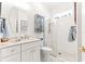 Bright white bathroom with glass enclosed shower and modern finishes at 9120 Se 125Th Loop, Summerfield, FL 34491