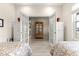 Bright bedroom with hardwood style floors and white trim at 9120 Se 125Th Loop, Summerfield, FL 34491