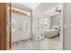 Bright bedroom with stylish patterned wallpaper and hardwood style floors at 9120 Se 125Th Loop, Summerfield, FL 34491