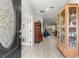 Inviting entryway showcasing hardwood style floors and glass paneled doors leading to a study at 9120 Se 125Th Loop, Summerfield, FL 34491