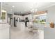 Modern kitchen with white cabinets, stainless steel appliances, and an island at 9120 Se 125Th Loop, Summerfield, FL 34491