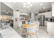 Open concept kitchen with island, stainless appliances, and dining area at 9120 Se 125Th Loop, Summerfield, FL 34491
