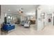 Spacious living room with hardwood style floors and access to an outdoor patio at 9120 Se 125Th Loop, Summerfield, FL 34491