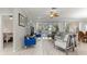 Spacious living room with hardwood style floors and access to an outdoor patio at 9120 Se 125Th Loop, Summerfield, FL 34491