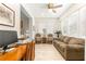 Cozy living area with plantation shutters, comfortable seating, and a bright ambiance at 9120 Se 125Th Loop, Summerfield, FL 34491