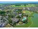 An aerial view showing the community pool, clubhouse, and surrounding greenery at 9948 Sw 69Th Ln, Ocala, FL 34481