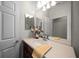 Bathroom featuring vanity, mirror, and neutral countertops at 9948 Sw 69Th Ln, Ocala, FL 34481