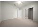 Neutral bedroom featuring carpet, ceiling fan, and mirrored closet at 9948 Sw 69Th Ln, Ocala, FL 34481