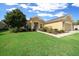 Charming single-story house with a well-kept lawn and landscaping, plus a sidewalk leading to the front door at 9948 Sw 69Th Ln, Ocala, FL 34481