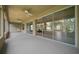 Spacious lanai with multiple ceiling fans and sliding glass doors for seamless indoor-outdoor living at 9948 Sw 69Th Ln, Ocala, FL 34481