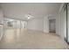 Spacious living room featuring tile flooring, neutral paint, and multiple windows at 9948 Sw 69Th Ln, Ocala, FL 34481