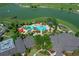 Overhead aerial image showing the community pool with lounge chairs and landscaping at 9948 Sw 69Th Ln, Ocala, FL 34481
