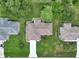 The aerial view showcases the home's pristine landscaping, neutral roof, and the inviting walkway to the front door at 10086 Sw 62Nd Terrace Rd, Ocala, FL 34476