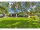 The expansive backyard is perfect for recreation, framed by mature trees and lush landscaping at 10086 Sw 62Nd Terrace Rd, Ocala, FL 34476