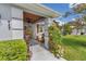 Inviting covered front porch with beautiful columns and lush landscaping at 10086 Sw 62Nd Terrace Rd, Ocala, FL 34476