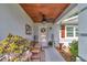 Cozy, covered front porch with decorative features and ample seating at 10086 Sw 62Nd Terrace Rd, Ocala, FL 34476