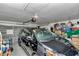 Spacious garage features a black car and ample storage space with an automatic door opener at 10086 Sw 62Nd Terrace Rd, Ocala, FL 34476