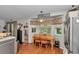 Kitchen nook with table, wooden chairs, and window bringing in lots of natural light at 10086 Sw 62Nd Terrace Rd, Ocala, FL 34476