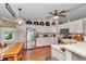 Well-lit kitchen features updated appliances and laminate flooring, perfect for cooking and dining at 10086 Sw 62Nd Terrace Rd, Ocala, FL 34476