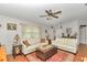 Inviting living room with hardwood floors, neutral tones, and ample seating at 10086 Sw 62Nd Terrace Rd, Ocala, FL 34476