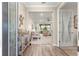Inviting entryway showcases beautiful wood-look tile flooring leading into the home's bright and open living space at 10597 Sw 90Th Street Rd, Ocala, FL 34481