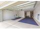 Spacious two-car garage featuring overhead storage and ample room for vehicles and tools at 10597 Sw 90Th Street Rd, Ocala, FL 34481