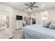 Comfortable main bedroom with walk-in closet and a neutral color palette at 10597 Sw 90Th Street Rd, Ocala, FL 34481