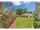 This home has a spacious backyard with lush landscaping, perfect for relaxation and outdoor enjoyment at 10819 Sw 84Th Ter, Ocala, FL 34481