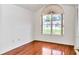 Bedroom featuring wood floors, a bright window, and good natural light at 10819 Sw 84Th Ter, Ocala, FL 34481