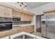 Modern kitchen features stainless appliances, light wood cabinets, and sleek countertops at 10819 Sw 84Th Ter, Ocala, FL 34481