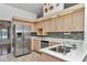 Well-appointed kitchen with stainless steel appliances, white countertops, and tile backsplash at 10819 Sw 84Th Ter, Ocala, FL 34481