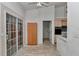 Eat-in kitchen featuring sliding glass doors, light cabinets, and tile floors at 10819 Sw 84Th Ter, Ocala, FL 34481