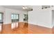 Bright and airy living room features hardwood floors, large windows, and access to outdoor space at 10819 Sw 84Th Ter, Ocala, FL 34481