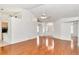 Open living area with hardwood floors connecting to the kitchen and foyer; ideal for gatherings at 10819 Sw 84Th Ter, Ocala, FL 34481