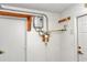 Utility room with water heater and filter system, providing essential home services at 10819 Sw 84Th Ter, Ocala, FL 34481