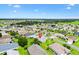 Aerial view of the property in a residential neighborhood with golf course nearby at 12178 Se 174Th Pl, Summerfield, FL 34491