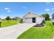 Charming single-story home with a well-manicured lawn and a two-car garage at 12178 Se 174Th Pl, Summerfield, FL 34491