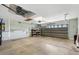 Spacious two car garage with abundant storage, and garage door at 12178 Se 174Th Pl, Summerfield, FL 34491