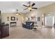 Comfortable living room with vaulted ceiling offering seamless flow to the kitchen and entry at 12178 Se 174Th Pl, Summerfield, FL 34491